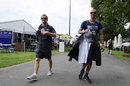 Nico Rosberg walks through the paddock with his trainer