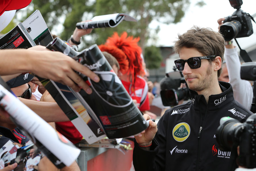 Romain Grosjean signs autographs