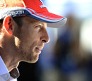 Jenson Button talks to the press