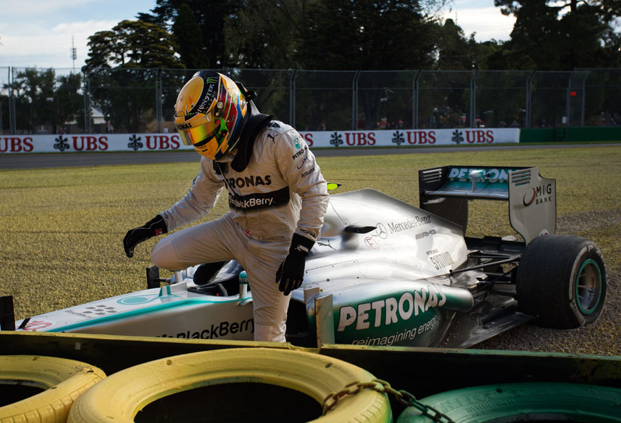 Lewis Hamilton climbs out of his Mercedes after running off at Turn 6