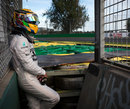 Lewis Hamilton waits for a lift after running off at Turn 6