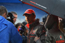 A soggy Jenson Button chats to the media