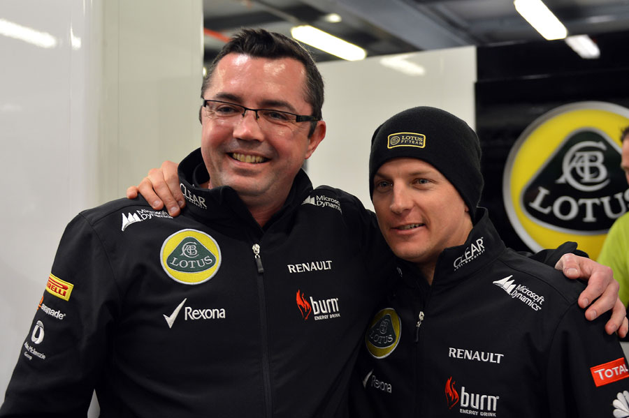 Kimi Raikkonen celebrates his victory with Eric Boullier