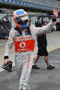 Jenson Button waves to the crowd after qualifying
