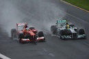 Fernando Alonso and Lewis Hamilton on track