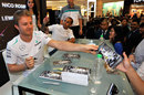 Lewis Hamilton and Nico Rosberg sign autographs in Kuala Lumpur