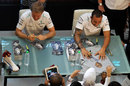 Lewis Hamilton and Nico Rosberg sign autographs in Kuala Lumpur
