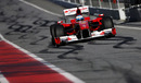 Fernando Alonso makes his way down the pit lane