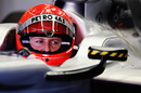 Michael Schumacher checks his mirrors