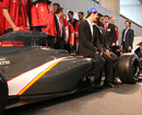 Bruno Senna and Karun Chandhok sit on the new HRT F1 car