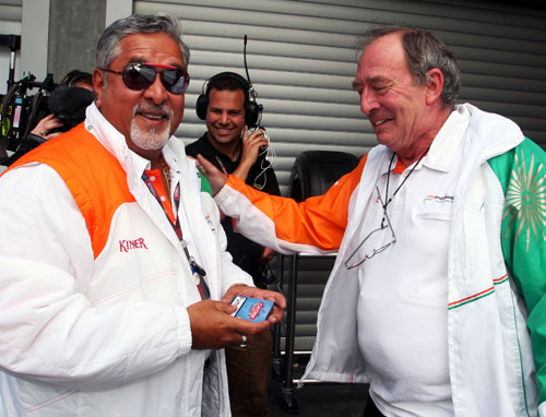 Vijay Mallya and Ian Phillips celebrate Force India's pole position