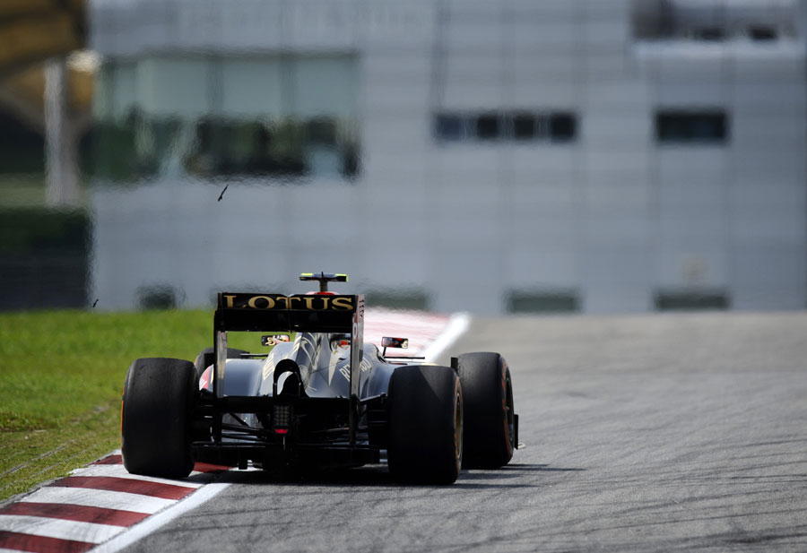 Strips of rubber fly off Romain Grosjean's tyres