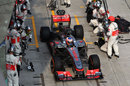Jenson Button leaves the McLaren pit box