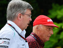 Mercedes bosses Ross Brawn and Niki Lauda walk through the paddock
