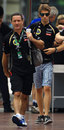 Romain Grosjean arrives in the paddock with his trainer Benoit Campargue