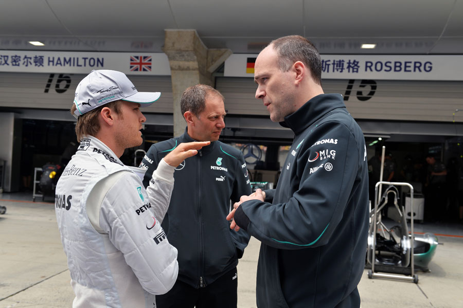 Nico Rosberg deep in discussion in the pit lane