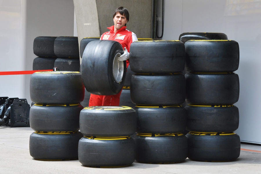 A Ferrari mechanic organises the team's allocation of Pirelli tyres