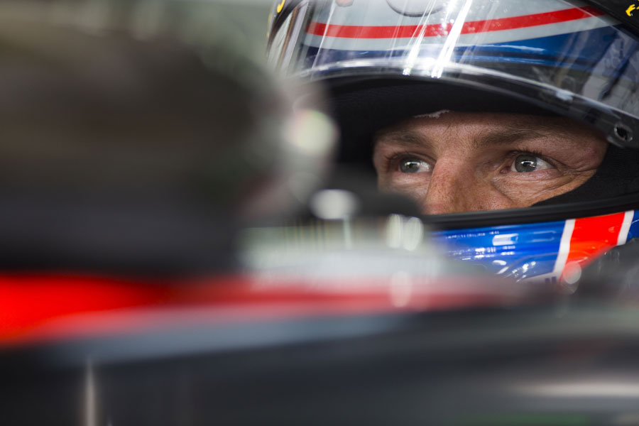 A focused Jenson Button in his McLaren cockpit