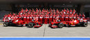 Ferrari pose for a team photo in the pit lane