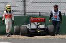 Sergio Perez walks away after crashing his McLaren in the pit lane