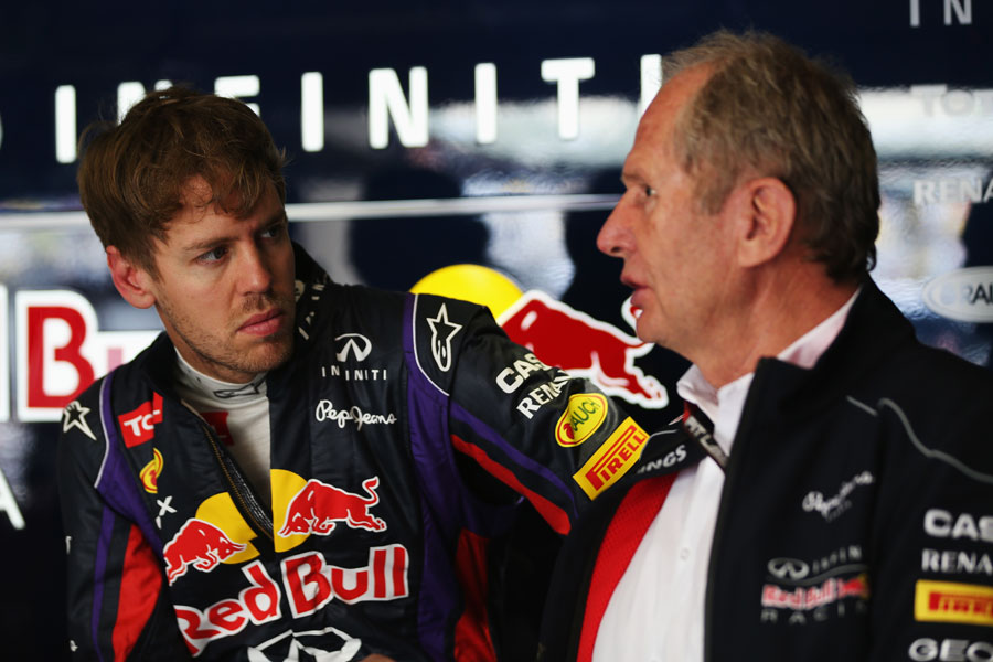 Sebastian Vettel talks to Helmut Marko in the Red Bull garage