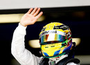 Lewis Hamilton waves to the crowd after securing pole position