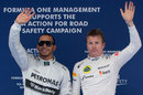 Lewis Hamilton and Kimi Raikkonen acknowledge the crowd after qualifying