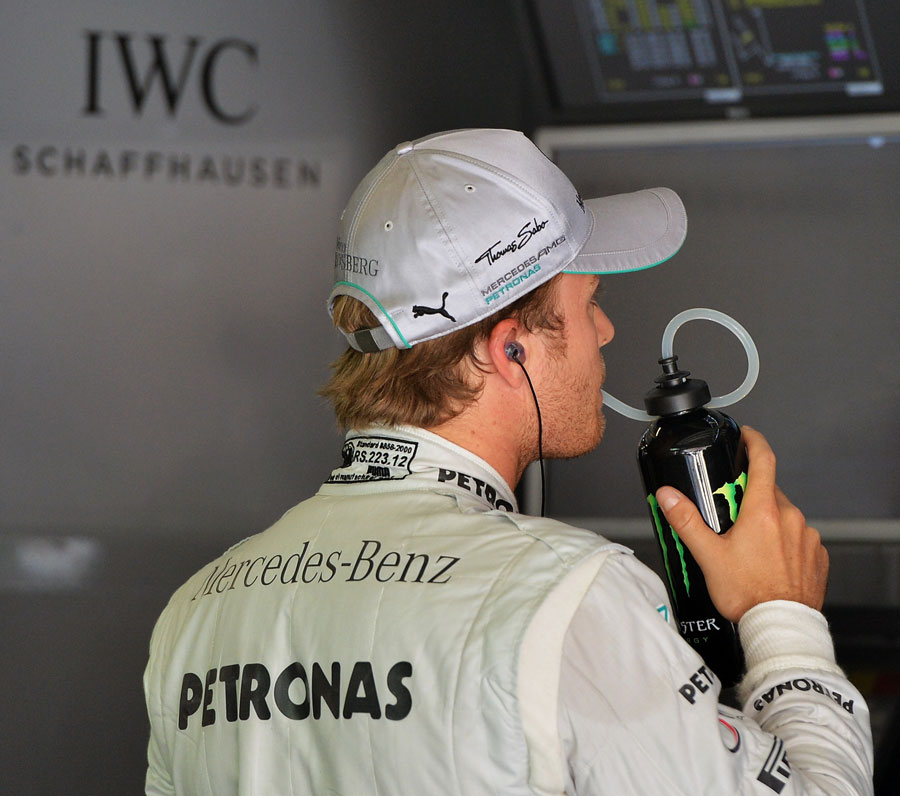 Nico Rosberg keeps an eye on the timing screens