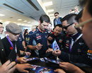 Mark Webber signs autographs for Red Bull VIPs