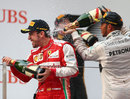 Fernando Alonso celebrates with Lewis Hamilton on the podium