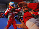 Fernando Alonso celebrates with his team after winning in China