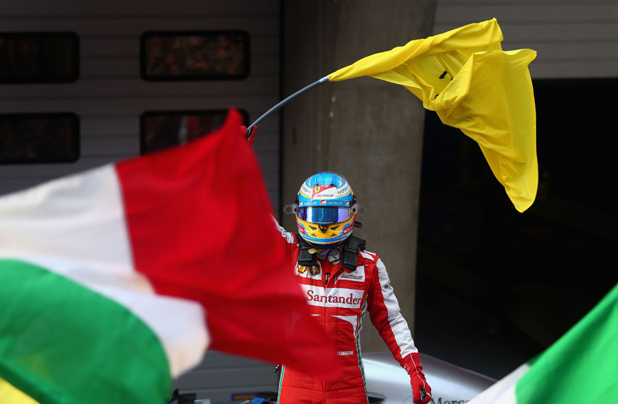 Fernando Alonso celebrates after winning in China