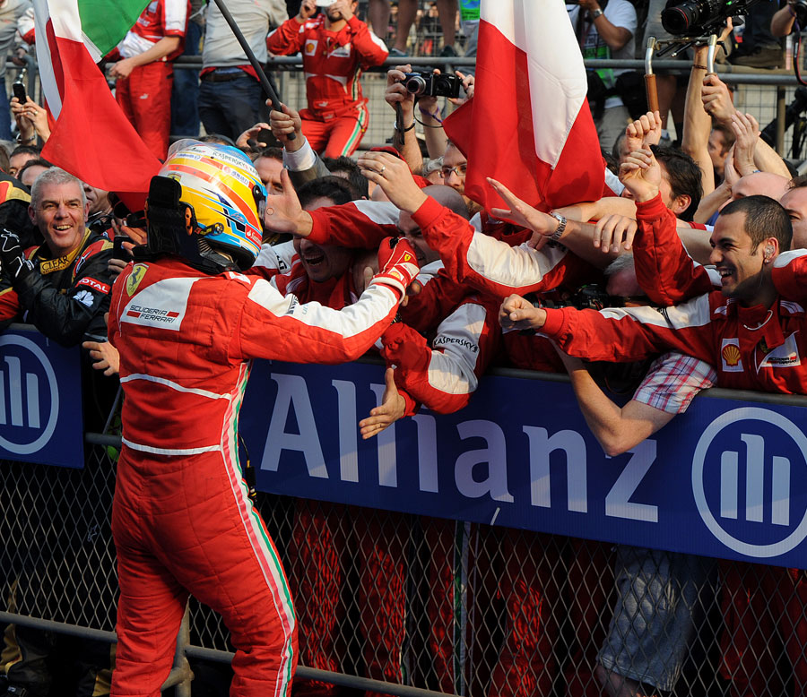Fernando Alonso celebrates after winning in China
