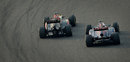 Kimi Raikkonen passes Daniel Ricciardo around the outside