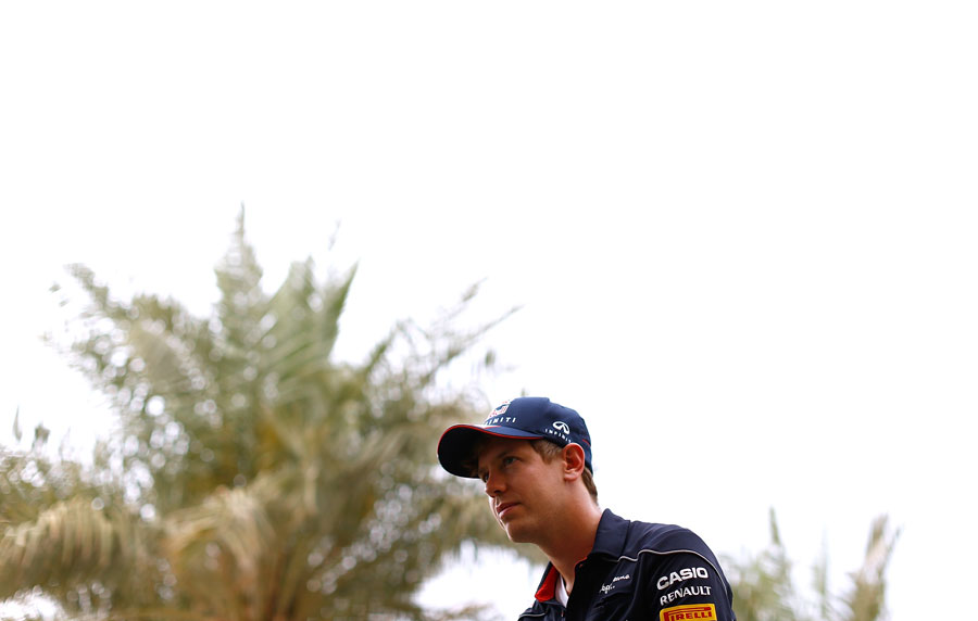 Sebastian Vettel conducts interviews in the paddock