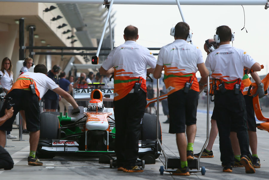 Adrian Sutil hits his pit marks outside the Force India garage