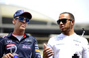 Sebastian Vettel and Lewis Hamilton chat on the drivers' parade