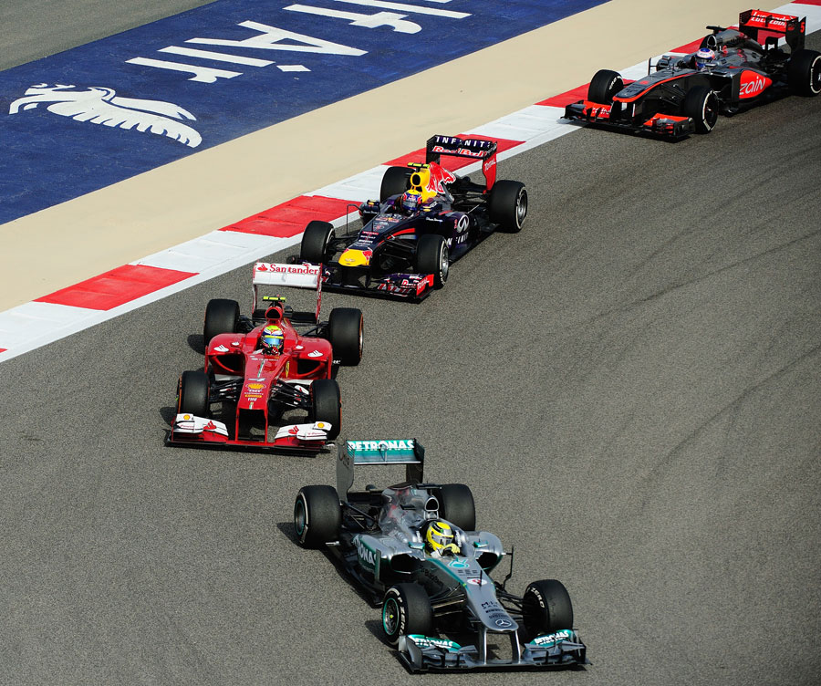 Nico Rosberg leads a gaggle of cars through turn 10
