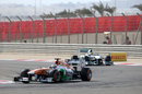 Paul di Resta leads Lewis Hamilton in to Turn 4