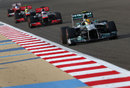 Lewis Hamilton ahead of the two McLarens