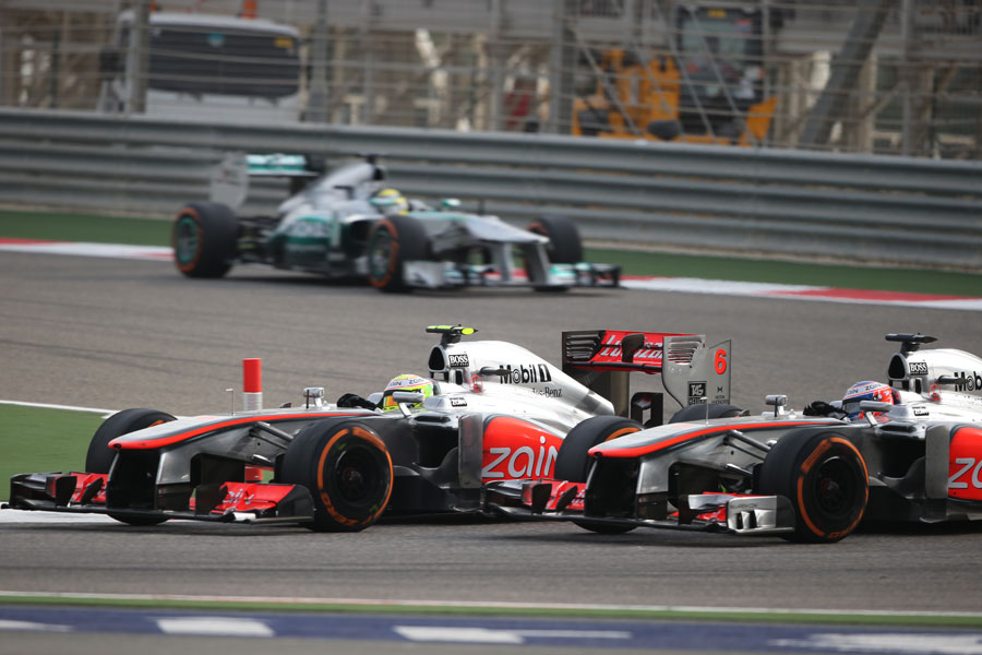 Sergio Perez and Jenson Button battle through Turn 1