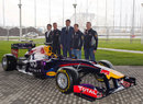 Sebastian Vettel poses with officials while visiting the Sochi Olympic Park