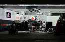 McLaren mechanics work into the night on Sergio Perez's car