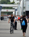 Jean-Eric Vergne cycles through the paddock