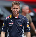 Sebastian Vettel walks through the paddock