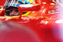 Fernando Alonso waits in the cockpit of his Ferrari