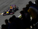 Mark Webber passes the main grandstand