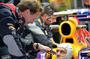 Christian Horner chats to Sebastian Vettel in the cockpit of his Red Bull