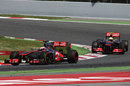Jenson Button leads Sergio Perez on track