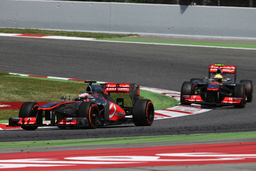 Jenson Button leads Sergio Perez on track